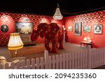 Small photo of DRESDEN, GERMANY - 28. October 2021: Banksy artwork elephant in the room installation. Rebuilt in the unauthorized exhibition in a small room. Paintings are on the wall. Replica of the complete room.