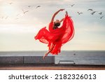 Jumping ballerina in a red...