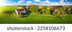 Small photo of House in idyllic countryside in Austria, Europe, with a solar panel on the roof surrounded with beautiful vast meadow and trees