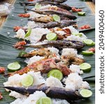 Small photo of SERANGAN, BALI, INDONESIA-OCT 2016: PICNIC MENU, RICE WITH SEAFOOD AND SPICY SAUCE