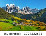 Famous alpine place  Santa Maddalena village with magical Dolomites mountains in background, Val di Funes valley, Trentino Alto Adige region, Italy