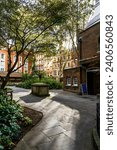 Small photo of London, UK - October 5, 2023: Postman's Park, public garden near St Paul's Cathedral, with the Memorial to Heroic Self-Sacrifice, dedicated to ordinary people who died while saving the lives of others