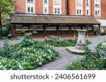 Small photo of London, UK - October 5, 2023: Memorial to Heroic Self-Sacrifice, dedicated to ordinary people who died while saving the lives of others, in Postman's Park, near St Paul's Cathedral, London, UK