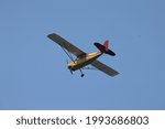 Small photo of Corolla, North Carolina, USA - June 18, 2021: 1974 BELLANCA 7GCAA owned by OBX Airplanes flying over historic Corolla park