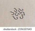 Small photo of Black fishhook on isolated background