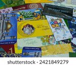 Small photo of Terengganu, Malaysia - 2 February 2024 : Close-up of hari raya aidilfitri money envelop. Various of beautiful design. Sampul duit raya idilfitri.