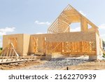 installation of rafters of a plywood house building wall studs wooden framework wooden