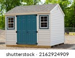 Gray color prefab gardening tools storage shed in the house backyard nature dress facade new modern