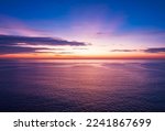Aerial view sunset sky, Nature beautiful Light Sunset or sunrise over sea, Colorful dramatic majestic scenery Sky with Amazing clouds and waves in sunset sky purple light cloud background