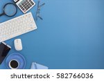 Office desk table of Business workplace and business objects on blue background.Business background concept Copy space