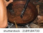 Small photo of the process of making diamonds or lunkhead in a large cauldron