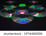 A Pile Of Cd Rom On Black....