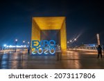 Small photo of Dubai, United Arab Emirates - October 3, 2020: Dubai EXPO 2020 sign and entrance gate of Alif Mobility Pavilion with characteristic architecture built for the postponed EXPO in Dubai, UAE