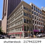 Small photo of New York, NY - June 29, 2022: 319 Broadway (1870) is 5-story Italianate cast-iron building on Thomas St and Broadway in Tribeca. It is the lone survivor of a pair of buildings: the "Thomas Twins"