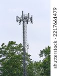Small photo of Pelham, NH USA - July 31, 2022: This cell tower or cell site towers over the trees in rural New Hampshire.