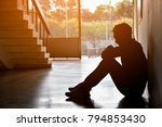Silhouette of Sad Depressed Insomnia Man.Sitting Against Sunset. The Protection and Treatment of Major Depressive Disorder Problem Concept.