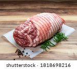 Small photo of Boneless Leg of Lamb with rosemary, rock salt and peppercorn on wax paper
