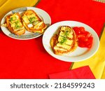 Small photo of Served classic homemade Czech, Central European dish (Czechia,Poland, Slovakia, Hungary) Eggy Bread also known as a local version of French toast with mould-ripened, chives and cherry tomatoes on it.
