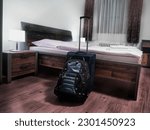 Set of luggage inside queen sized bed hotel room after check-in arrival, Brno, Czechia, Czech Republic, Europe, European Union (EU)