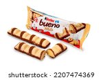 Small photo of Alba, Italy - September 28, 2022: Kinder Bueno White, wafer covered with white chocolate and cocoa nibs, filled with hazelnut cream. It is a Ferrero brand, important Italian confectionery factory