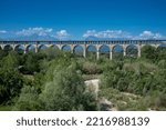 Small photo of Cuneo, Piedmont, Italy : The Soleri viaduct, it is a promiscuous road and rail bridge on the Stura di Demonte river, in the background the mountains of the Alps