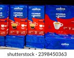 Small photo of Italy - November 29, 2023: Ground Lavazza Crema e Gusto coffee for espresso and mocha machines in packs displayed for sale in Italian supermarket