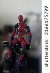 Small photo of Yogyakarta Indonesia - May 22 2022: Deadpool on a tripod with a bokeh background
