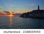 Sunset in beautiful Rovinj town (popular tourist resort and an active fishing port) at sunset. The old town of Rovinj, Istria, Croatia.