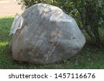 Small photo of YAROSLAVL, RUSSIA - SEPTEMBER 08, 2018: the stumbling stone - a huge boulder with a reminder of a dispute about the beard