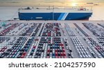 Small photo of Aerial view vehicle carrier vessel loading car for shipping to worldwide, Large RoRo (Roll on off) vehicle car carrier, New car lined up in the port for import export around the world.