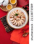 Small photo of Top view of delicious sliced chicken roll soaked in Chinese wine named drunken shrimp for lunar new year's dishes.