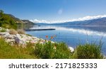 Okanagan Lake Canada. Summer landscape of a lake and mountains in the background in early morning. Concept relaxation. Perfect spot for tourists and quiet nature walks. Travel photo, nobody, copyspace