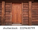 Wooden front door in to rustic...
