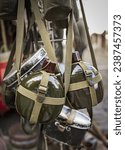 Small photo of Russian Soviet Red Army Soldier's Military Equipment Of World War II. Flasks And Holster Hanging. A soldier's water flask. Soldier's uniform. An army soldier's water canister.