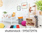 Small photo of Little baby interior deigned in scandinavian style with colorful accents