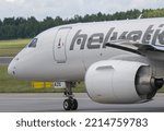 Small photo of Vilnius, Lithuania – June, 2022: Helvetic Airways Embraer E190-E2 HB-AZG. Helvetic Airways (Previously Odette Airways) is a Swiss regional airline.