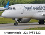 Small photo of Vilnius, Lithuania – June, 2022: Helvetic Airways Embraer E190-E2 HB-AZG. Helvetic Airways (Previously Odette Airways) is a Swiss regional airline.