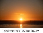 beautiful sunset landscape at sea with clear and cloudless sky golden hour