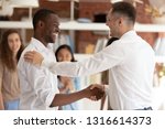Small photo of Caucasian executive boss handshaking promoting successful happy african black worker expressing gratitude praising shaking hand appreciating for good work, reward recognition acknowledgement concept