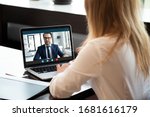 Small photo of Back view of young businesswoman talk with male business partner using video call on modern laptop, female employee speak consult with businessman on webcam conference, online consultation concept