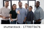 Small photo of Millennial male leader stretch out his hand for handshake welcoming new employee invites newcomer to corporate team, group showing amity, human resources, boss greets clients express respect concept