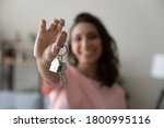 Small photo of Crop close up of female tenant renter show praise house keys moving to first own new apartment or house, happy woman owner buy purchase home, relocate to dwelling, rental, rent, ownership concept