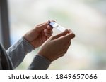 Small photo of Two bars. Close up of woman hands holding positive home pregnancy test, confused female meeting unexpected gestation thinking making difficult choice, happy lady receiving news of awaited maternity