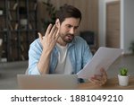 Small photo of Unhappy young Caucasian man feel distressed frustrated by bad news in post letter correspondence. Upset millennial male confused stressed with negative response or dismissal notice in paperwork.