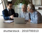 Small photo of Older clients consulting agent, broker about house selling, medical insurance terms, trust fund investment, meeting at laptop in office. Senior couple discussing wills with lawyer, solicitor, notary