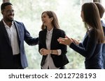 Small photo of Happy diverse business team applauding coworker success. Employees congratulating promoted colleague, expressing gratitude, recognition, appreciation for good job result, work achieve