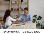 Small photo of Client thanking expert for consultation with handshake after meeting. Employer hiring candidate after interview, welcoming to team, shaking hand. Professional getting job