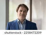 Small photo of Positive middle aged business leader man in formal jacket head shot portrait. Confident mature male CEO, company owner, director, boss, businessman looking at camera, smiling