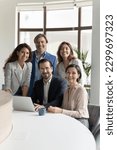 Small photo of Five millennial and mature businesspeople smiling look at camera pose together in modern office. Executive managers, successful company members, corporate staff portrait. Career, promotion, business