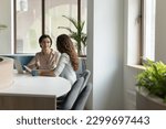 Small photo of Serious mature female executive manager lead formal meeting with company client in office, make commercial offer, share information, convince customer to buy services met in modern workspace. Business